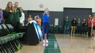 Watch Elise Dahlby sing the national anthem before the state volleyball title match
