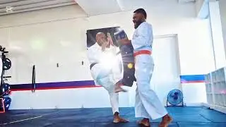 Inside East Gate Karate Academy. Pad work session 