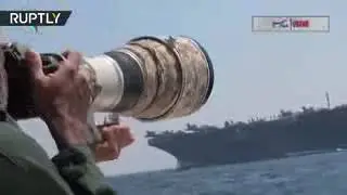Iranian speedboats chase US aircraft carrier in Hormuz Strait