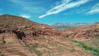 Dr.One takes off from our campsite near St. George, Utah for a closer look at the red cliffs. 😎