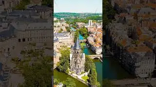 Vertical video. Metz, France. New Temple - Protestant Church. Moselle River. View of the historic...