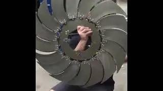 This iris goes on the front of a SU-29 plane to control the amount of air passing the engine.