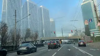 Drive across the foggy bridge over Kyiv's main avenue