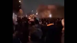 People chant slogans against the leader of the mullahs in a nightly demonstration in Karaj.