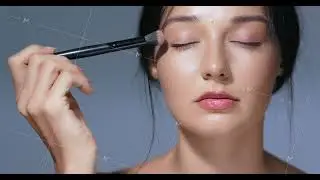 Woman Applying Eyeshadow With Brush Highlighting Natural Beauty And Radiance