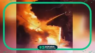 Extensive damage after a 2-alarm warehouse fire in Hamilton Township