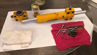 John Deere double acting steering cylinder removal Backhoe 310 410