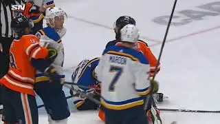 Jujhar Khaira crosschcek on Vince Dunn's head.