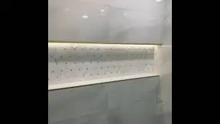 LED Lighted wall to wall bathroom shower niche .