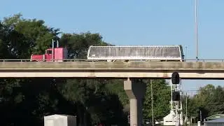 Red Semi Dump truck going over a bridge in Bellevue, Ohio