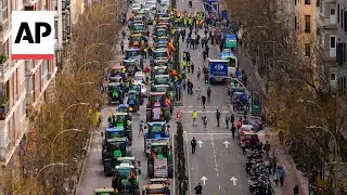 Hundreds of tractors advance on Madrid as farmers protest EU policies