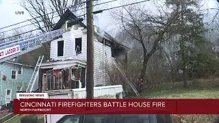 Cincinnati firefighters battle house fire