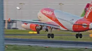Plane Landing at Lisbon Airport During Sunset with Tire Smoke
