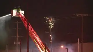 Firefighters battle industrial building fire in Grand Rapids
