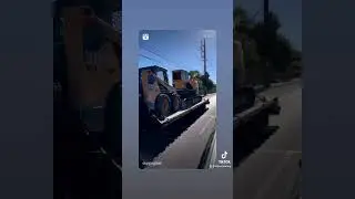 Dodge 3500 pulling excavator and skid steer