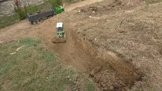 Rc mountain road extracting landfill from a slope
