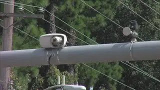 Verify: Do you have to pay a red light camera ticket?
