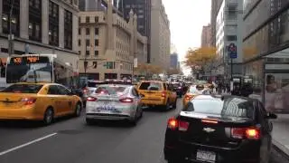 NYPD CRUISER, RESPONDING IN HEAVY TRAFFIC WITH BROKEN RUMBLER SIREN, ON W. 58TH ST. IN MANHATTAN.