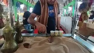 ARABIC COFFEE COOKED ON DESERT SAND (orient festival Parma)