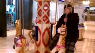 Collin & Daijah on the carousel @ Potomac Mills Mall