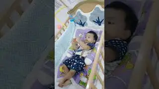 baby Mikail playing with musical mobile cot.#baby #cutebaby #crib #babycot