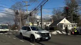 Crossing guard works busy intersection in Norwalk