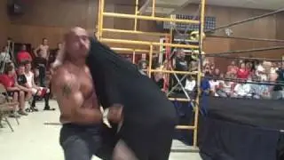 Vargas suplexes Jason Gotti on the concrete floor