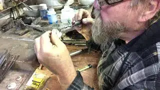 Soldering coin into ring. Finished Coin Ring