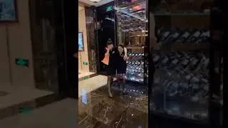 Drunk girl loses her high heels, she walks with black nylon  feet