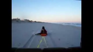 four wheeling , beach sledding in the sand