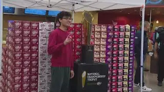 IU fans getting photos with national championship trophy at Bloomington Kroger