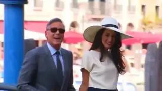 Clooney vows to sue French magazine over twins' photos