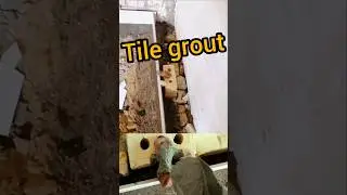 Fixing excess grout behind baseboard tile with bricks 🧱✨ #BaseboardTile #Bricks #GroutFix #Tiling