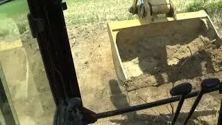 329 Cat Excavator cleaning out ditch.