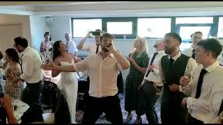 Secret Singers blasting out Mr Brightside with all the wedding guests.