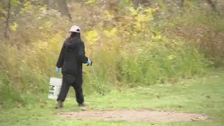 Green Bay Conservation Corps celebrates Halloween by cleaning trash from Baird Creek