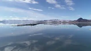 Stock Video - Rotating aerial view of water over the Bonneville Salt Flats