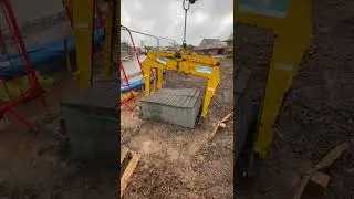digger lifting blocks with grab