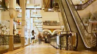 Shopping mall interior shop center time lapse crowd of people buying