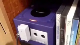 What happens when u put a mini DVD in a GameCube?