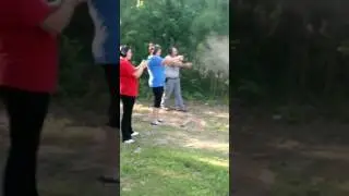 Dad, Mom, and Sister shooting pistols