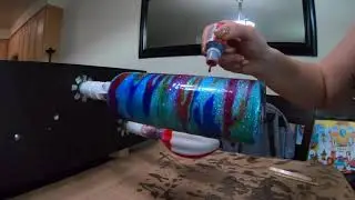 Alcohol inks over blue glitter cup time lapse
