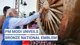 PM Modi Unveils Bronze National Emblem on Roof of New Parliament Building | The Quint