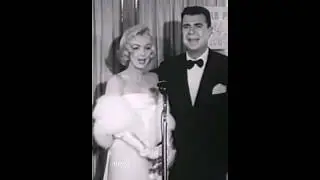 Marilyn Monroe talking with Ken Murray at the 