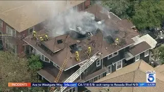 Fire crews battle house fire in Pico-Union