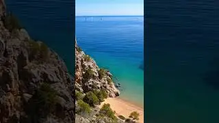 Coastal Serenity: Rocky Cliffs and Turquoise Waters