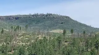 National guard helicopter flying over Lake Maloya