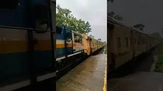 High speed train crossing at Cherukara station in rain