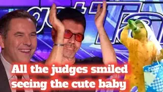 All the judges smiled when they saw the cute baby singing the song November Rain