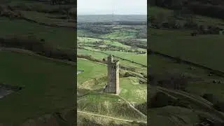 Flying over Castle Hill and Victoria Tower Huddersfield, West Yorkshire, UK
